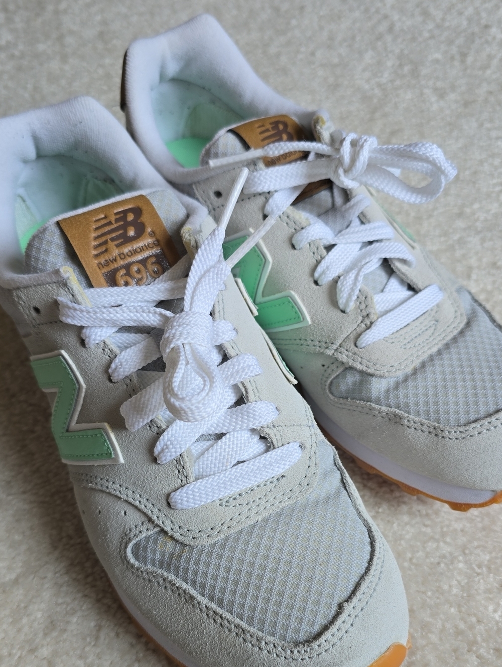 New Balance sneakers in mint green and light gray